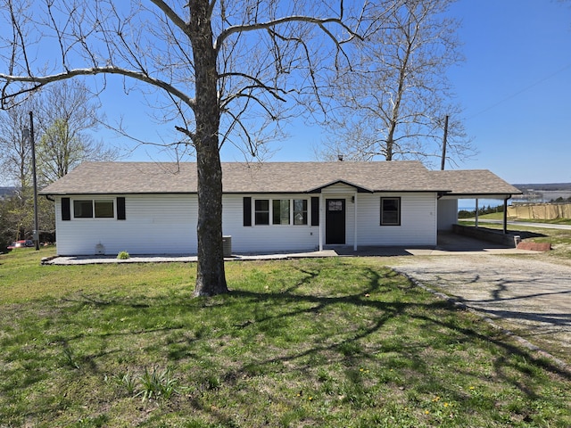21282 County Road 295, Hermitage, MO 65668 - ranch-style house featuring driveway, a front lawn, and an attached carport