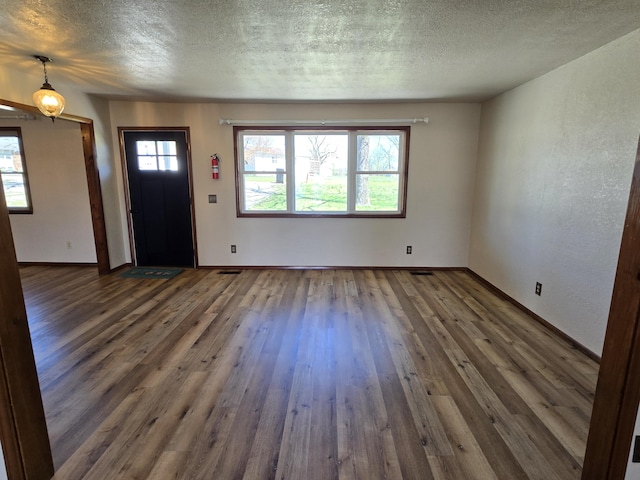 21282 County Road 295, Hermitage, MO 65668 - foyer entrance with baseboards, wood finished floors, and a textured ceiling
