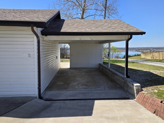 21282 County Road 295, Hermitage, MO 65668 - view of parking with a water view and a carport