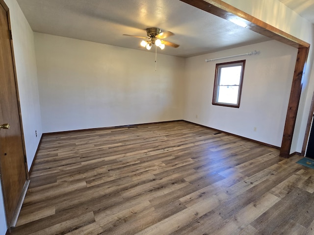 21282 County Road 295, Hermitage, MO 65668 - unfurnished bedroom featuring ceiling fan, baseboards, and wood finished floors