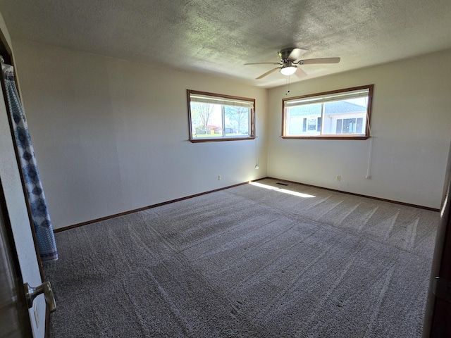 21282 County Road 295, Hermitage, MO 65668 - unfurnished room featuring a ceiling fan, baseboards, carpet floors, and a textured ceiling