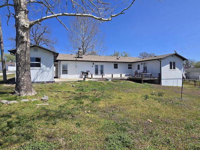 21282 County Road 295, Hermitage, MO 65668 - back of house with french doors, a wooden deck, a lawn, a shingled roof, and a patio