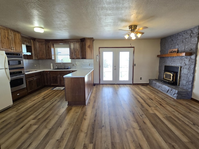 21282 County Road 295, Hermitage, MO 65668 - kitchen featuring light countertops, a sink, a textured ceiling, and a ceiling fan
