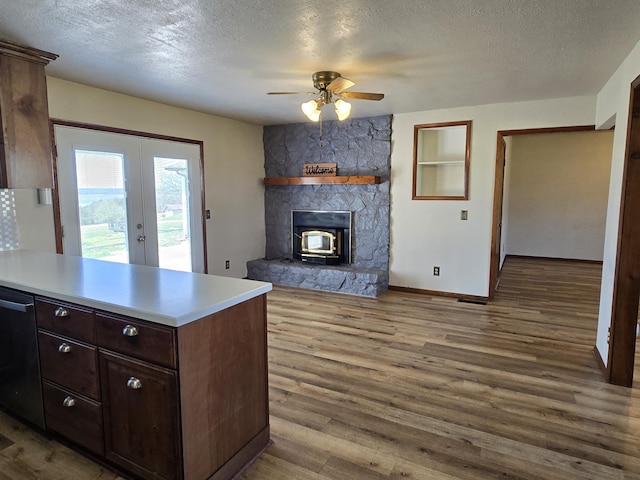 21282 County Road 295, Hermitage, MO 65668 - kitchen with ceiling fan, french doors, wood finished floors, and dishwashing machine