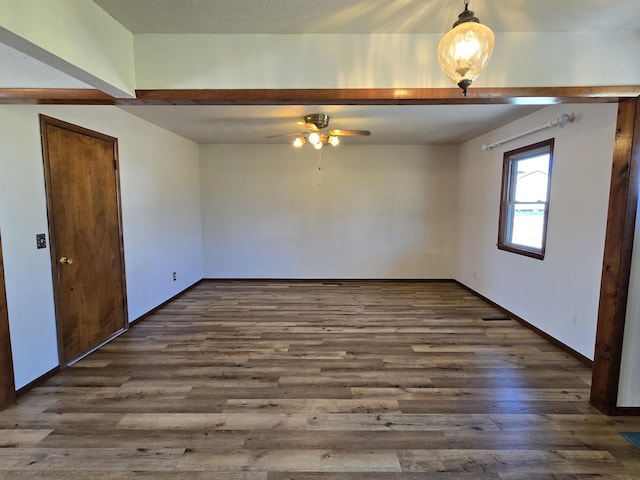 21282 County Road 295, Hermitage, MO 65668 - empty room with a ceiling fan, baseboards, and dark wood-style flooring
