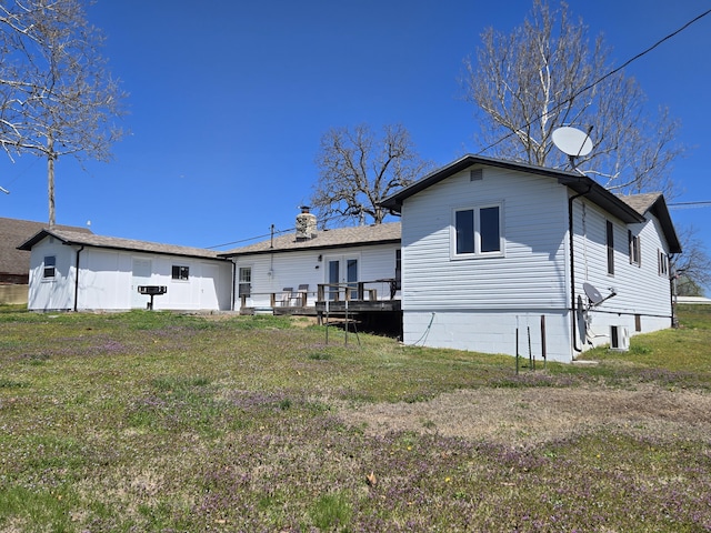 21282 County Road 295, Hermitage, MO 65668 - rear view of property featuring a lawn, a deck, and french doors
