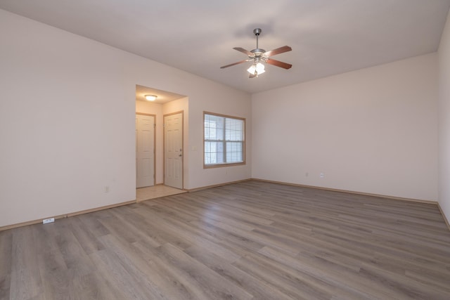 3335 W Countryside Dr, Springfield, MO 65807 - empty room featuring baseboards, a ceiling fan, and wood finished floors