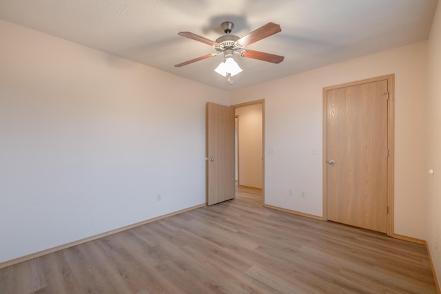 3335 W Countryside Dr, Springfield, MO 65807 - unfurnished bedroom featuring light wood-style floors, baseboards, and ceiling fan
