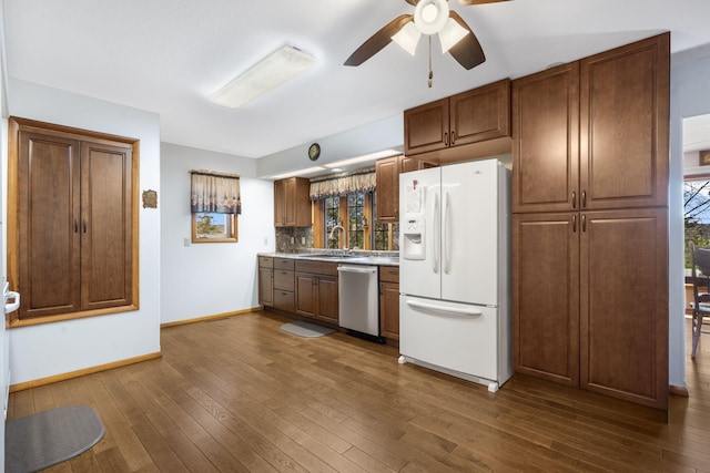 205 Forest Ln, Kimberling City, MO 65686 - kitchen with white refrigerator with ice dispenser, dishwasher, a sink, a ceiling fan, and dark wood-style floors