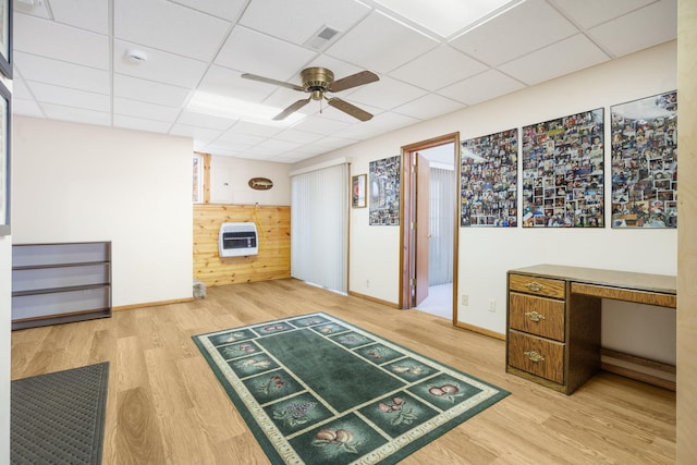 205 Forest Ln, Kimberling City, MO 65686 - unfurnished office featuring wood finished floors, heating unit, ceiling fan, a drop ceiling, and baseboards