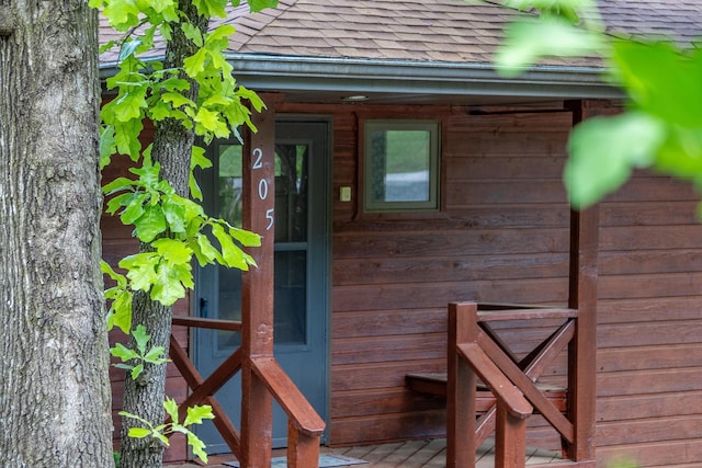 205 Forest Ln, Kimberling City, MO 65686 - property entrance featuring a shingled roof