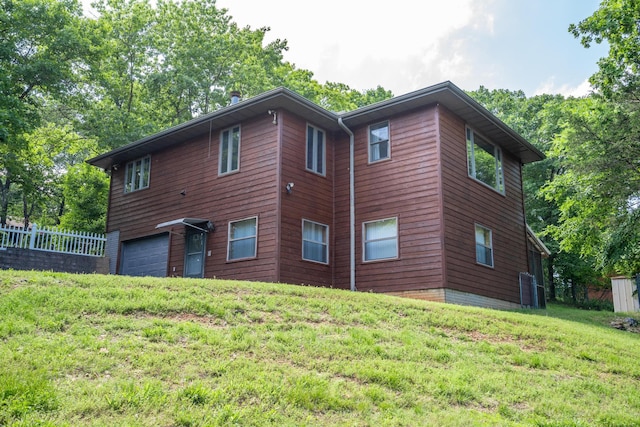 205 Forest Ln, Kimberling City, MO 65686 - view of side of home featuring a garage and central AC unit