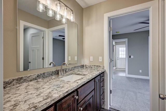 bathroom featuring baseboards and vanity