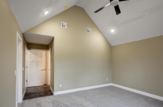 unfurnished room featuring baseboards, ceiling fan, dark colored carpet, and visible vents