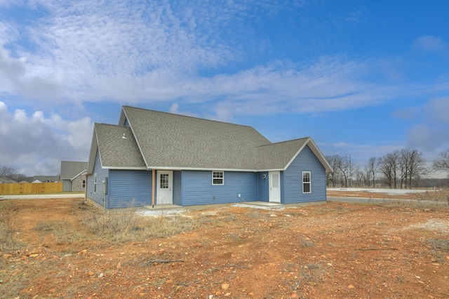 view of front of home with a shingled roof