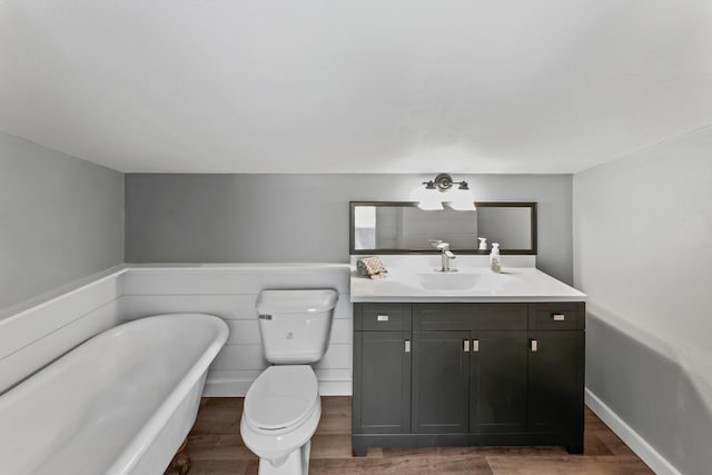 27857 Farm Rd Unit 1250, Golden, MO 65658 - full bath with vanity, a freestanding bath, wood finished floors, and toilet