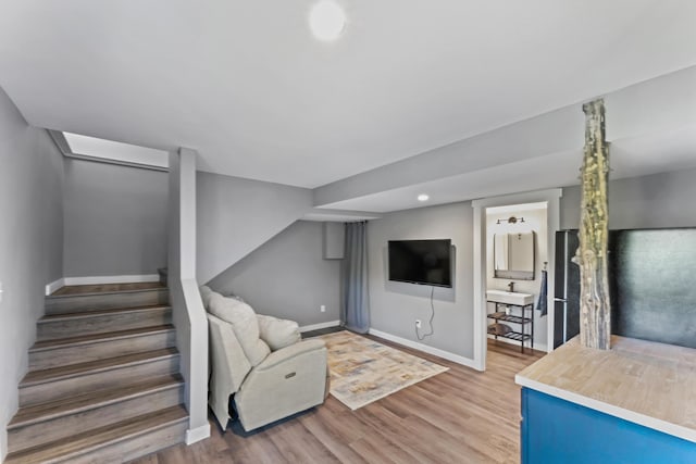 27857 Farm Rd Unit 1250, Golden, MO 65658 - living room with baseboards, light wood-style floors, and stairway
