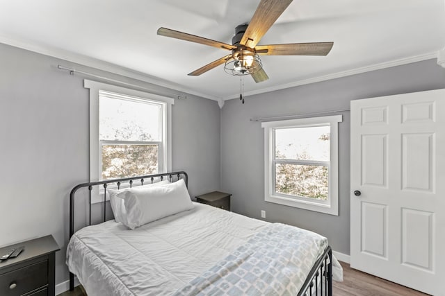 27857 Farm Rd Unit 1250, Golden, MO 65658 - bedroom featuring wood finished floors, ornamental molding, ceiling fan, and baseboards