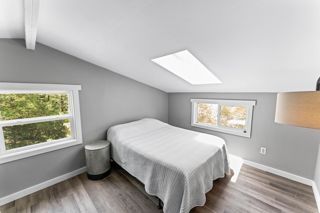 27857 Farm Rd Unit 1250, Golden, MO 65658 - bedroom featuring a skylight, wood finished floors, and baseboards