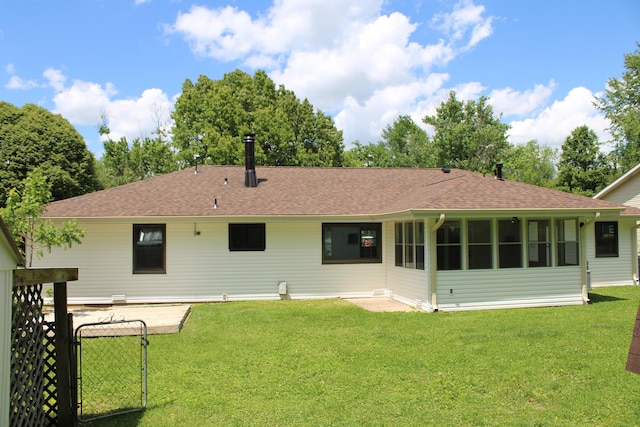 2558 W Village Ln, Springfield, MO 65807 - back of property with a shingled roof, a lawn, and a gate