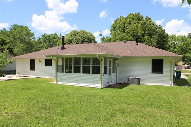 2558 W Village Ln, Springfield, MO 65807 - back of property featuring a shingled roof, cooling unit, and a sunroom
