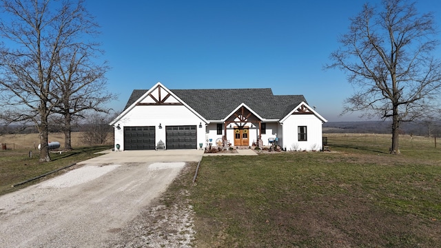 modern farmhouse with an attached garage, dirt driveway, a front lawn, and board and batten siding