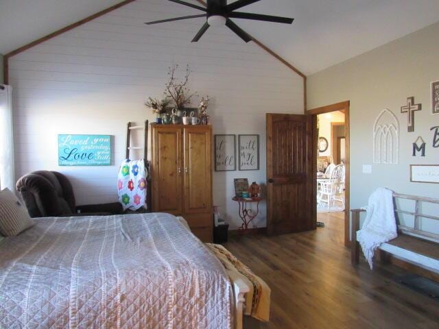 bedroom featuring a ceiling fan, wood finished floors, and high vaulted ceiling