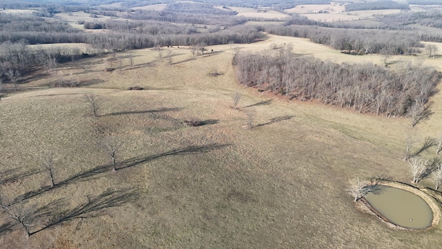birds eye view of property featuring a rural view