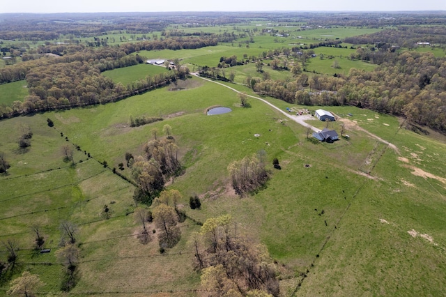 birds eye view of property with a rural view