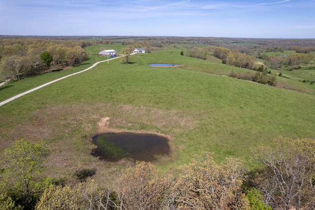 birds eye view of property with a rural view