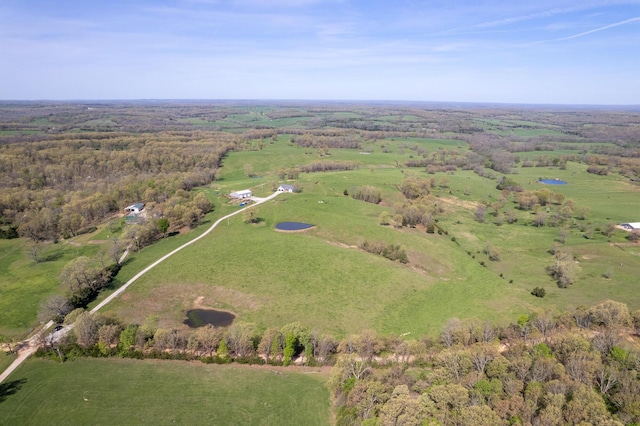 drone / aerial view with a view of trees