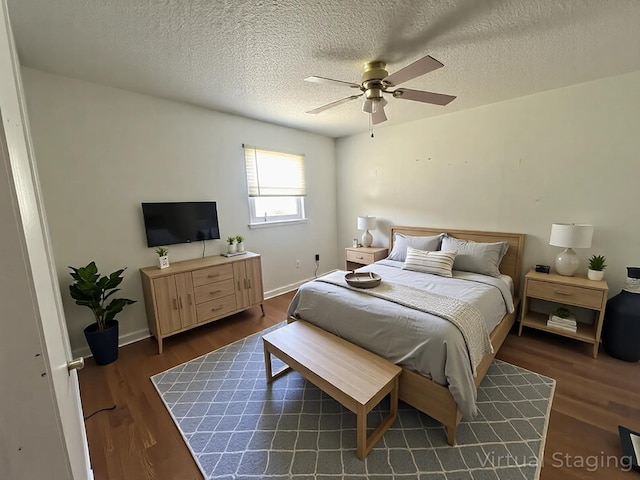 1131 Polk St, Warsaw, MO 65355 - bedroom featuring a textured ceiling, wood finished floors, ceiling fan, and baseboards