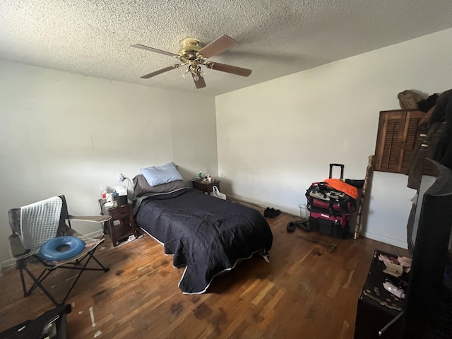 1131 Polk St, Warsaw, MO 65355 - bedroom featuring ceiling fan, wood finished floors, and a textured ceiling