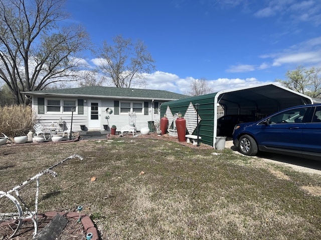 1131 Polk St, Warsaw, MO 65355 - view of front of property featuring a carport, entry steps, and a shingled roof