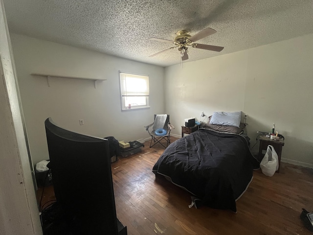 1131 Polk St, Warsaw, MO 65355 - bedroom featuring a textured ceiling, baseboards, a ceiling fan, and wood finished floors
