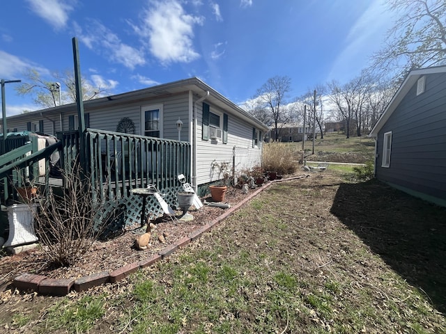 1131 Polk St, Warsaw, MO 65355 - view of side of home with a wooden deck
