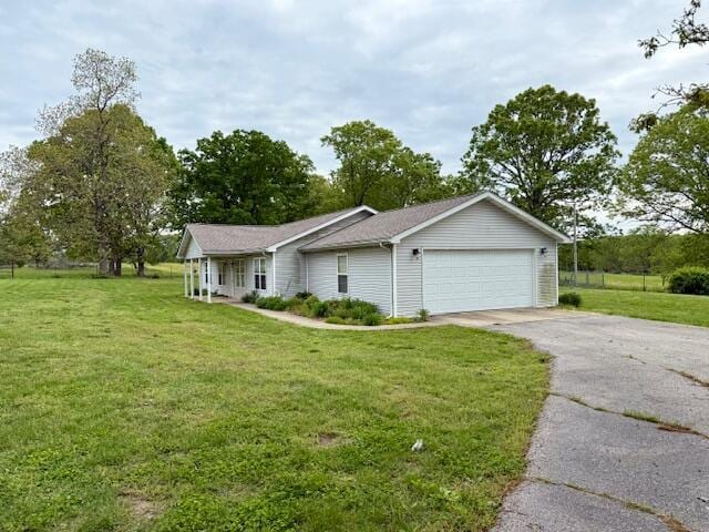1005 County Road 3030, Mountain View, MO 65548 - view of property exterior featuring a yard, an attached garage, and asphalt driveway
