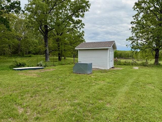 1005 County Road 3030, Mountain View, MO 65548 - view of green lawn with an outbuilding and a shed