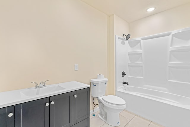 bathroom featuring washtub / shower combination, tile patterned flooring, vanity, and toilet
