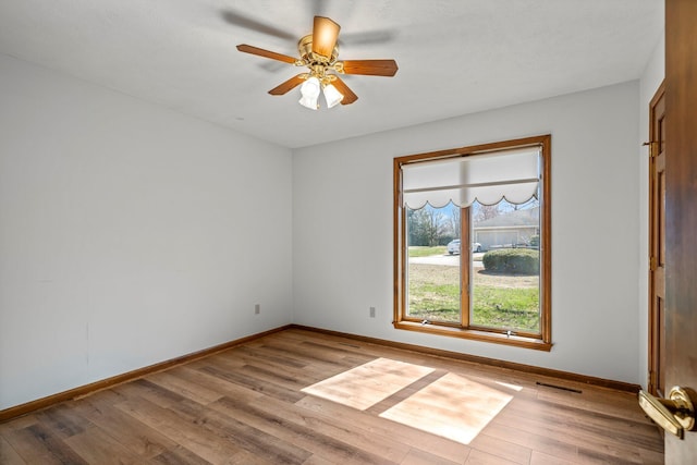 3131 E Southern Hills Blvd, Springfield, MO 65804 - unfurnished room with baseboards, ceiling fan, and wood finished floors