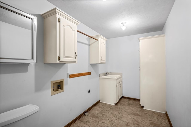 3131 E Southern Hills Blvd, Springfield, MO 65804 - washroom with a sink, baseboards, washer hookup, and a textured ceiling