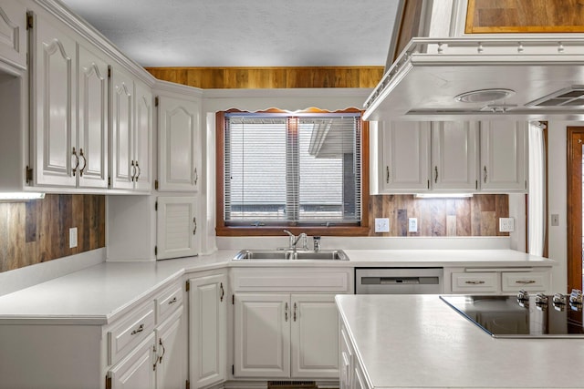 3131 E Southern Hills Blvd, Springfield, MO 65804 - kitchen with black electric stovetop, under cabinet range hood, a sink, and white cabinetry