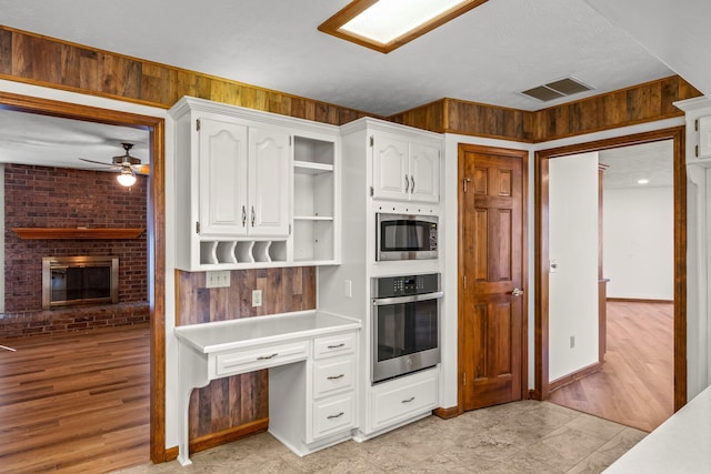 3131 E Southern Hills Blvd, Springfield, MO 65804 - kitchen featuring ceiling fan, open shelves, white cabinets, visible vents, and appliances with stainless steel finishes