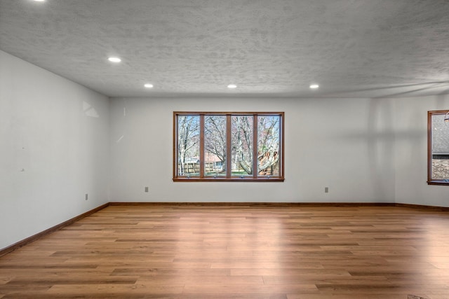 3131 E Southern Hills Blvd, Springfield, MO 65804 - empty room featuring a textured ceiling, wood finished floors, and recessed lighting