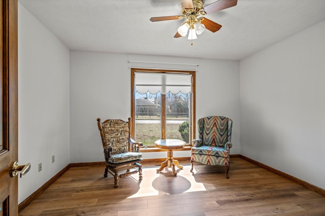 3131 E Southern Hills Blvd, Springfield, MO 65804 - sitting room featuring wood finished floors, ceiling fan, and baseboards