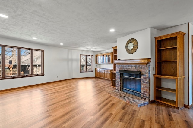 3131 E Southern Hills Blvd, Springfield, MO 65804 - unfurnished living room featuring baseboards, recessed lighting, and a fireplace