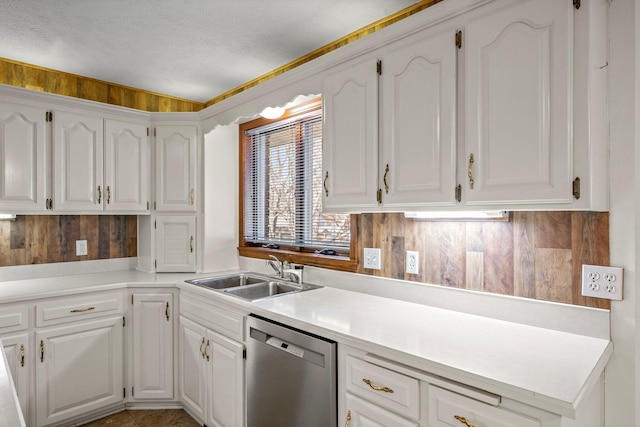 3131 E Southern Hills Blvd, Springfield, MO 65804 - kitchen featuring light countertops, a textured ceiling, white cabinets, stainless steel dishwasher, and a sink
