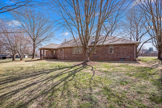 3131 E Southern Hills Blvd, Springfield, MO 65804 - view of side of property with a yard, brick siding, and crawl space
