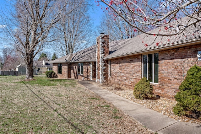 3131 E Southern Hills Blvd, Springfield, MO 65804 - exterior space with a shingled roof, brick siding, a chimney, and a lawn