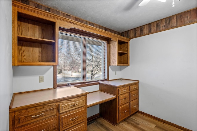 3131 E Southern Hills Blvd, Springfield, MO 65804 - unfurnished office with built in study area, a ceiling fan, wood finished floors, and baseboards